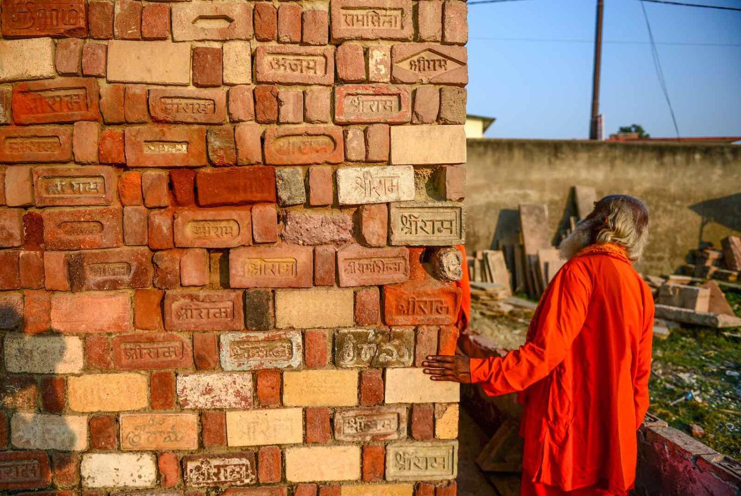 A Sadhu with bricks for the proposed Rama temple in Ayodhya following the Supreme Court verdict on the disputed religious site (Photo: Sanjay Kanojia/AFP/Getty Images)