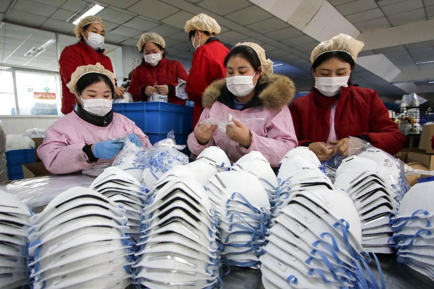 Producing face masks at a factory in Handan in China's northern Hebei province (Photo: AFP via Getty Images)