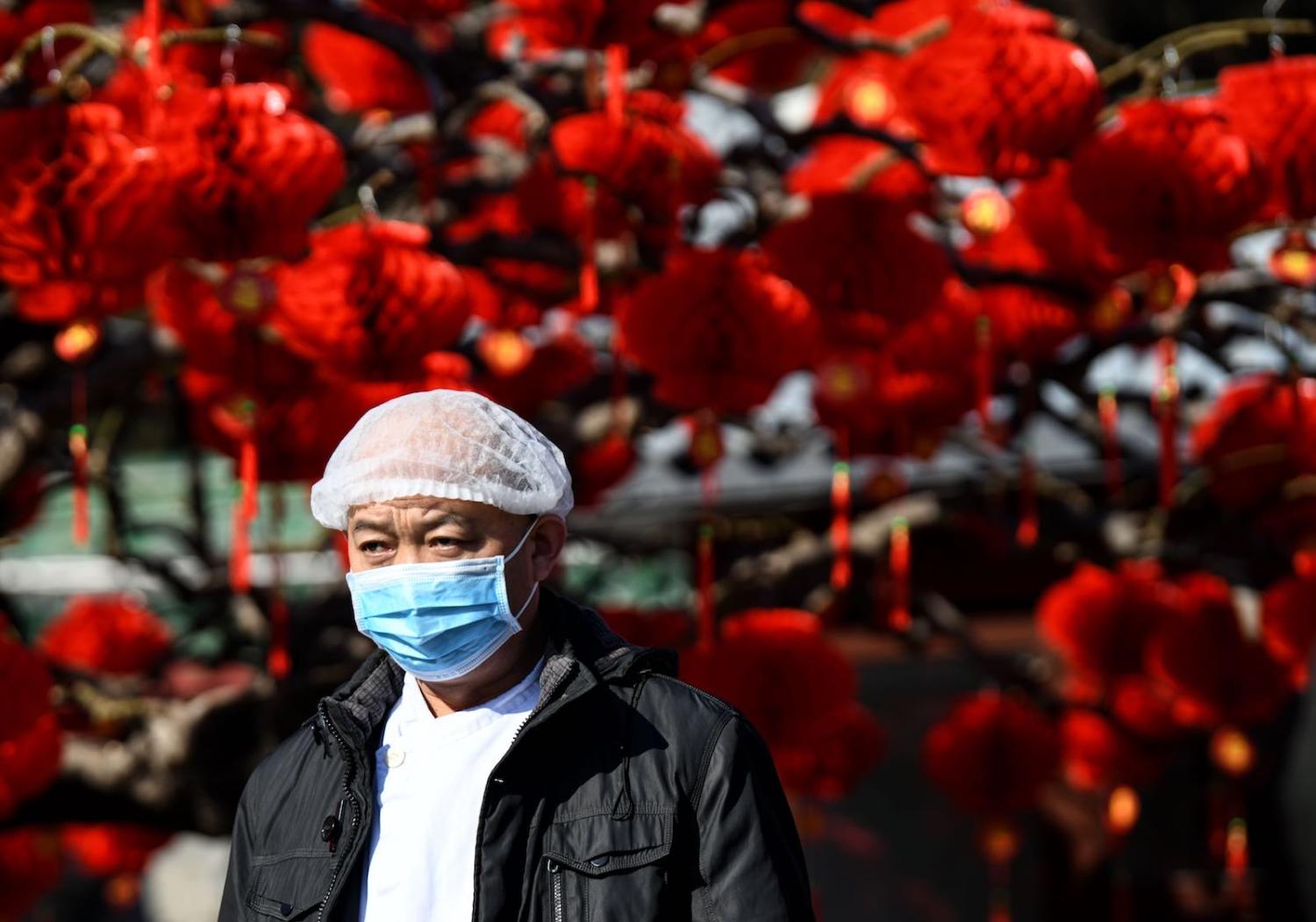 The difficulties of managing a public health crisis have been accentuated by timing, on the eve of Lunar New Year (Photo: Noel Celis/AFP/Getty Images)