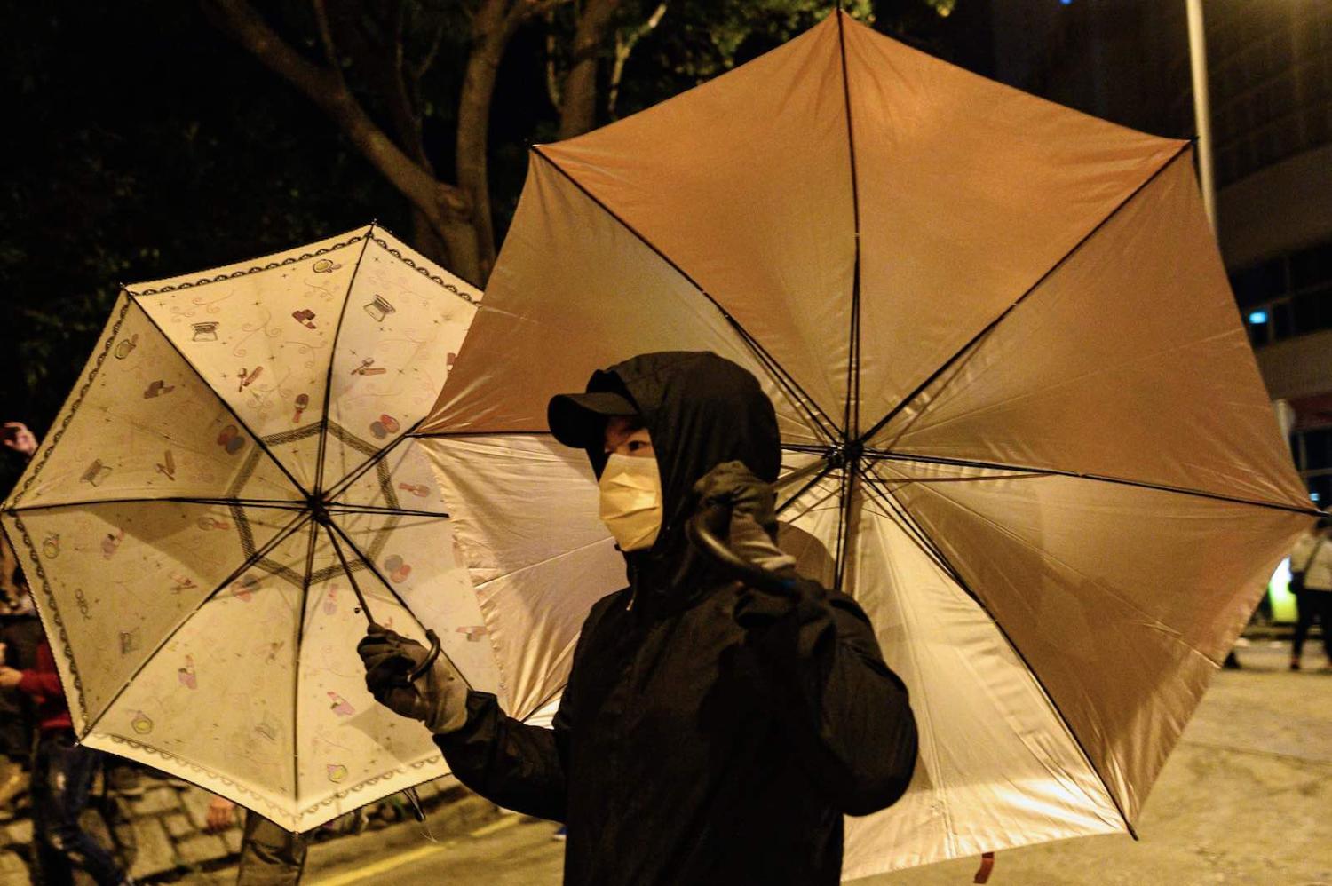 In the early weeks of the Covid-19 outbreak, Hong Kong residents protest setting up a quarantine area in their neighbourhood (Philip Fong/AFP/Getty Images)