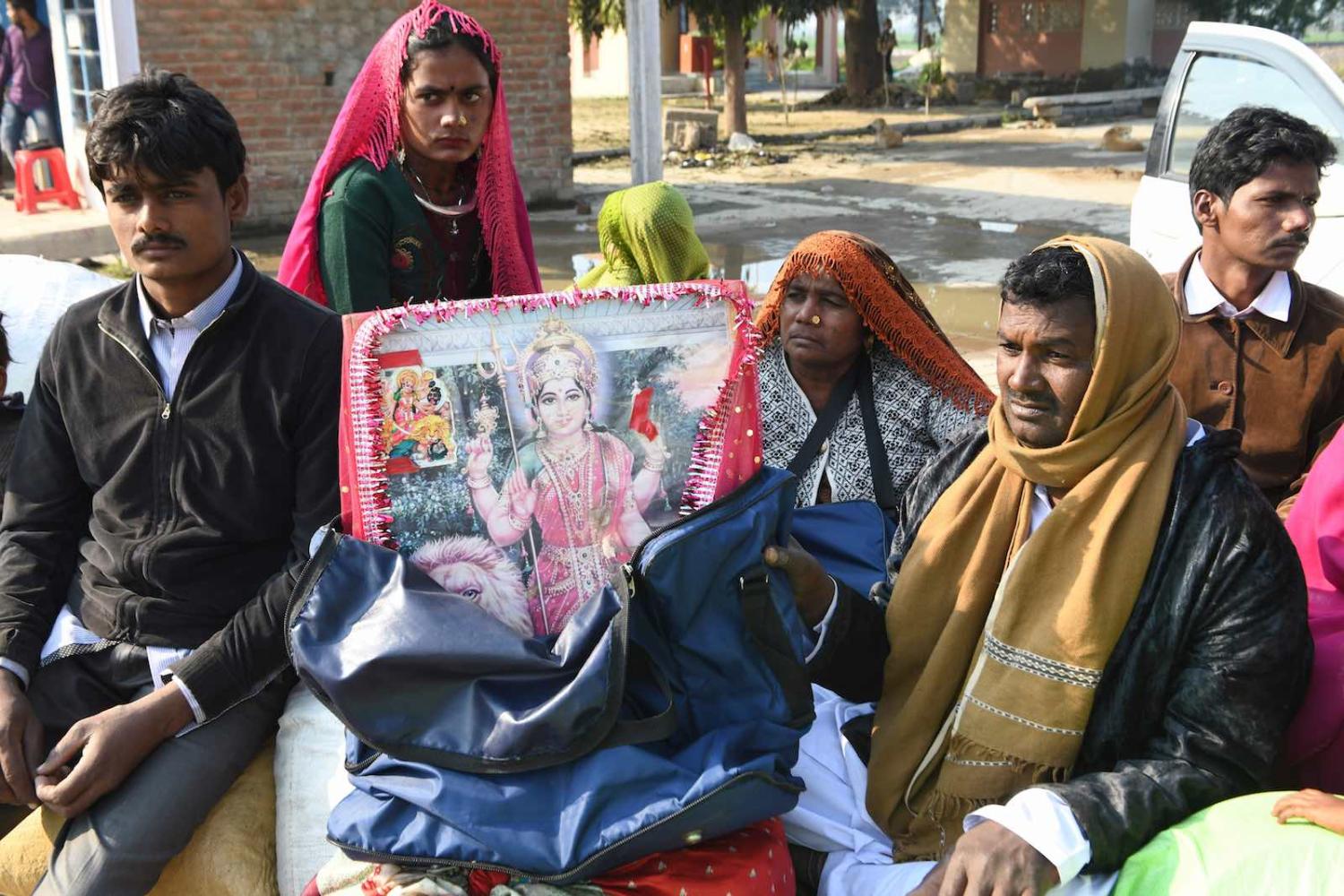Pakistani Hindu pilgrims wait at the India-Pakistan Wagah border post, near Amritsar on 3 February. (Narinder Nanu/AFP/Getty Images)