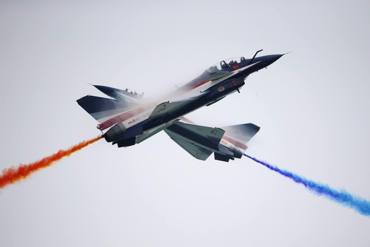 J-10 fighter jets of China's People’s Liberation Army Air Force Ba Yi aerobatics team perform during the Singapore Airshow in February (Suhaimi Abdullah/Getty Images)