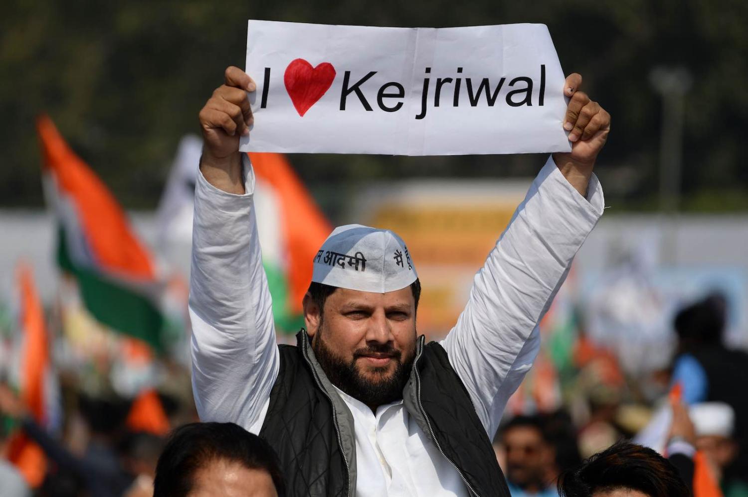 A supporter of the Aam Aadmi Party after Arvind Kejriwal’s victory as Delhi Chief Minister (Photo: Sajjad Hussain/AFP/Getty Images)