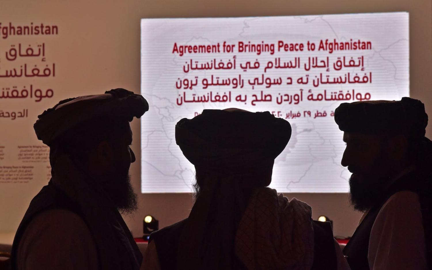 Members of the Taliban delegation attend the signing of a peace deal with the US, on 29 February 2020 in Doha, Qatar (Giuseppe Cacace/AFP via Getty Images)