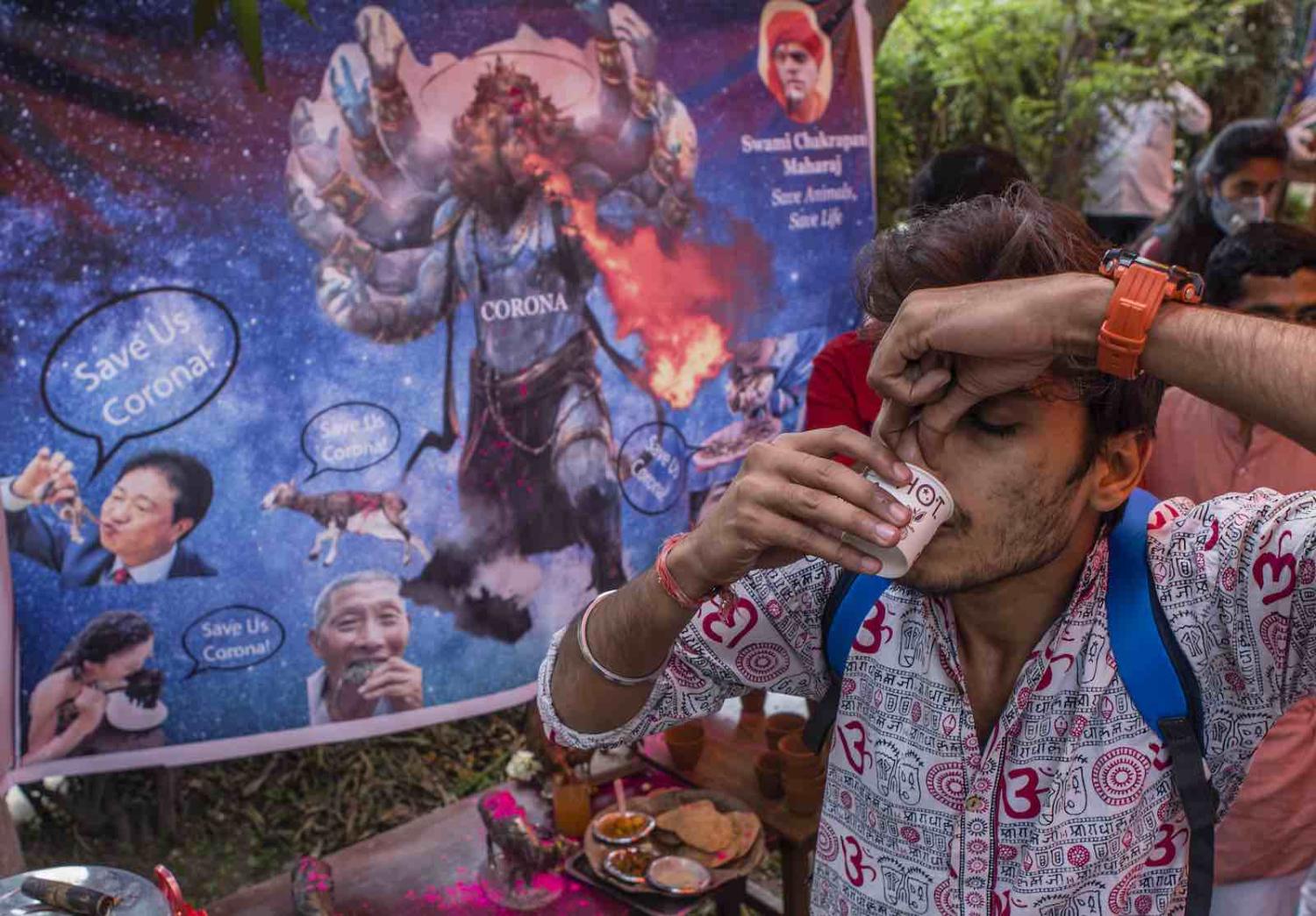  A urine drinking party to cure coronavirus infection, hosted by the Hindu organisation Akhil Bharat Hindu Mahasabha, 14 March in New Delhi, India 
