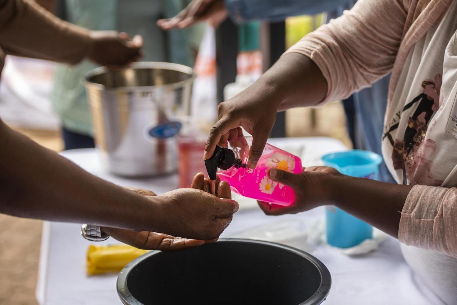 Handwashing before a media briefing on measures to prevent the spread of coronavirus, Midrand, South Africa, 18 March (Alet Pretorius/Gallo Images via Getty Images)