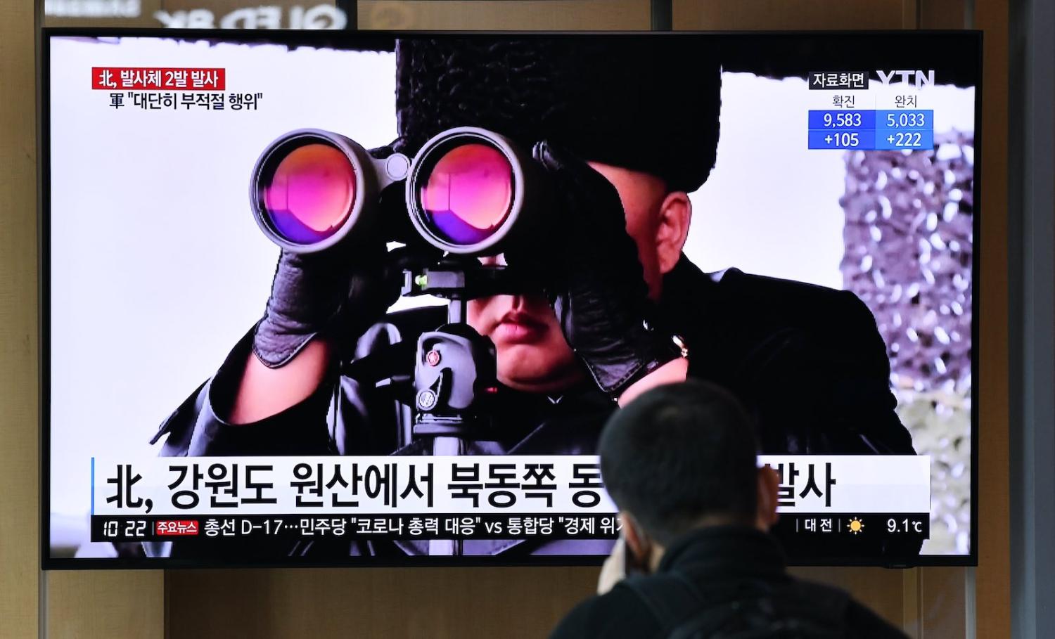 Watching North Korean leader Kim Jong-un watching a missile launch, 29 March 2020 (Jung Yeon-je/AFP via Getty Images)