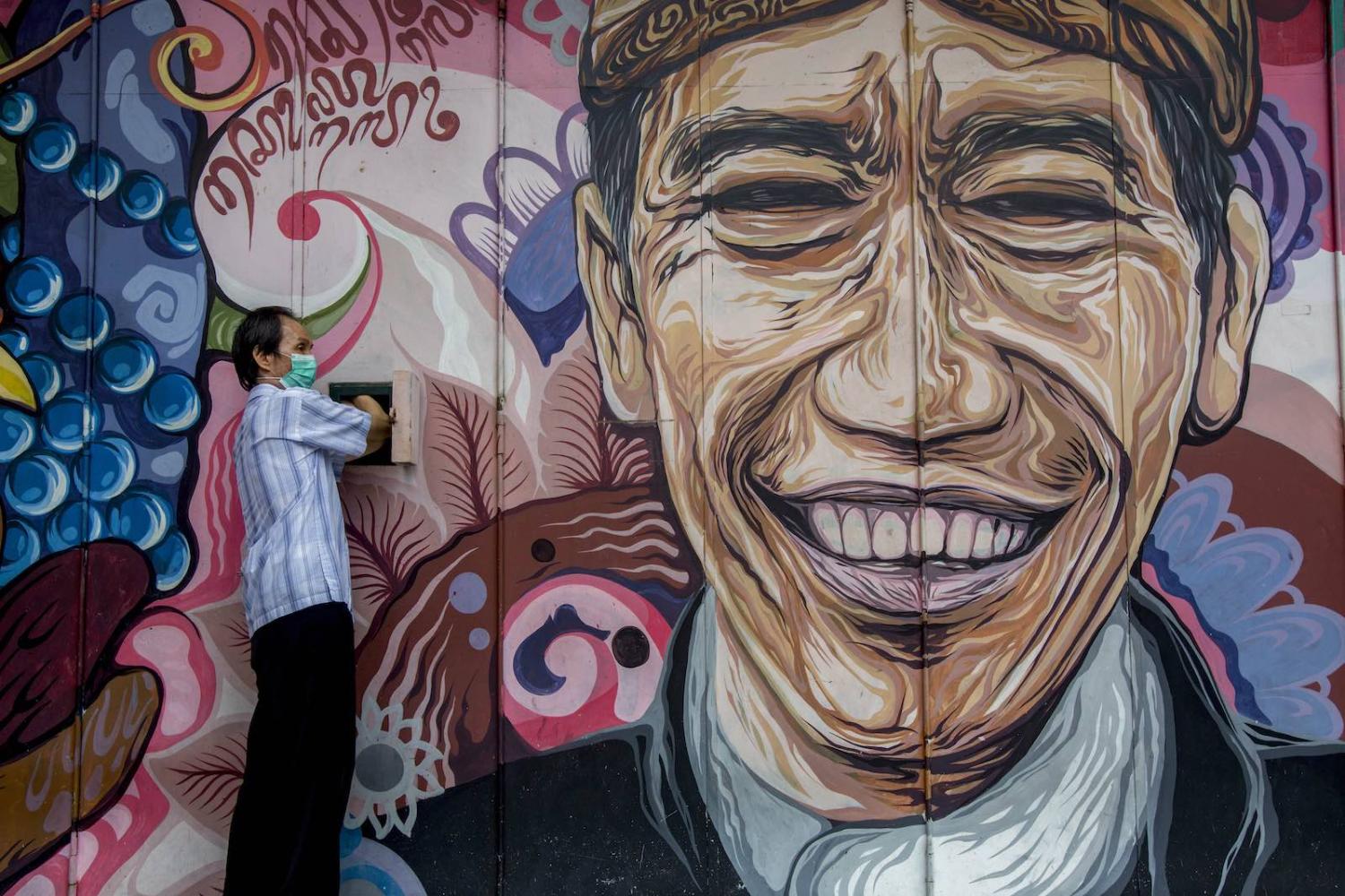 Street art depicting President Joko Widodo in Solo, Indonesia (Izzat Fahmi/Opn Images/Barcroft Media via Getty Images)