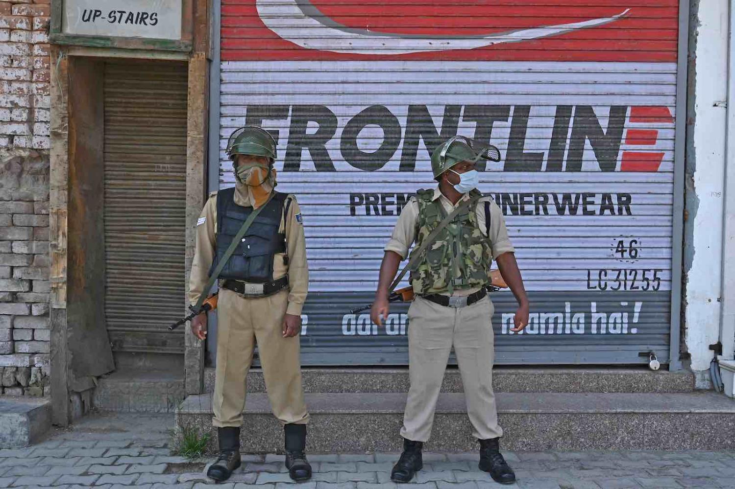 Indian paramilitary soldiers stand guard in central Srinagar, 10 June 2020 (Tauseef Mustafa/AFP via Getty Images)