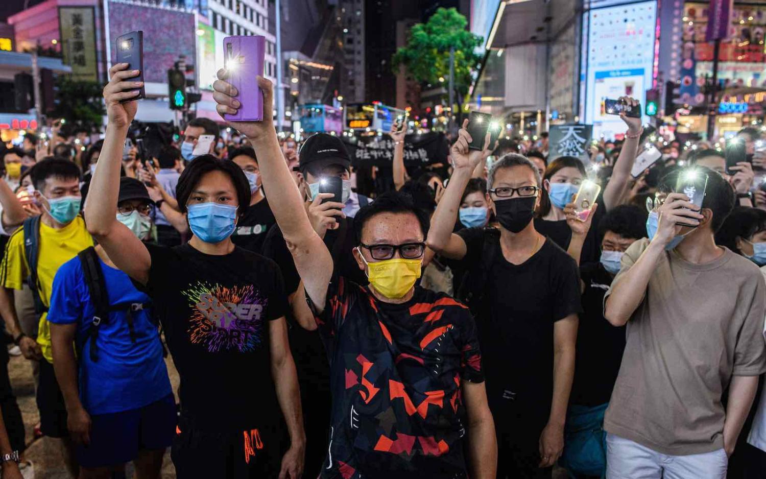 Pro-democracy activists at a rally in the Causeway Bay district of Hong Kong, 12 June 2020 (Anthony Wallace/AFP via Getty Images)