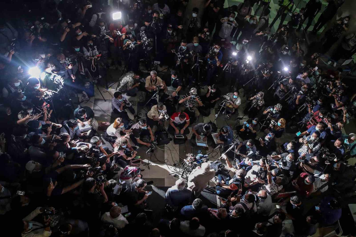 Malaysia's former prime minister Najib Razak (bottom at centre) speaks to the media after he was found guilty in his corruption trial in Kuala Lumpur last week (Fazry Isamil/AFP/Getty Images)
