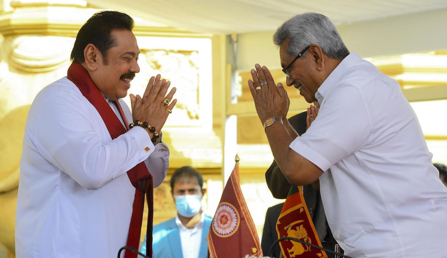 Sri Lanka’s President Gotabaya Rajapaksa (right) swears in his brother and former president Mahinda Rajapaksa as Sri Lanka’s new Prime Minister (Ishara S. Kodikara/AFP via Getty Images)