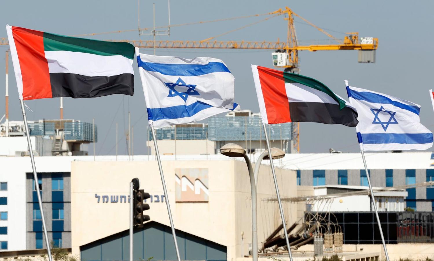 Israeli and United Arab Emirates flags line a road in the Israeli city of Netanya, 16 August 2020 (Jack Guez/AFP via Getty Images)