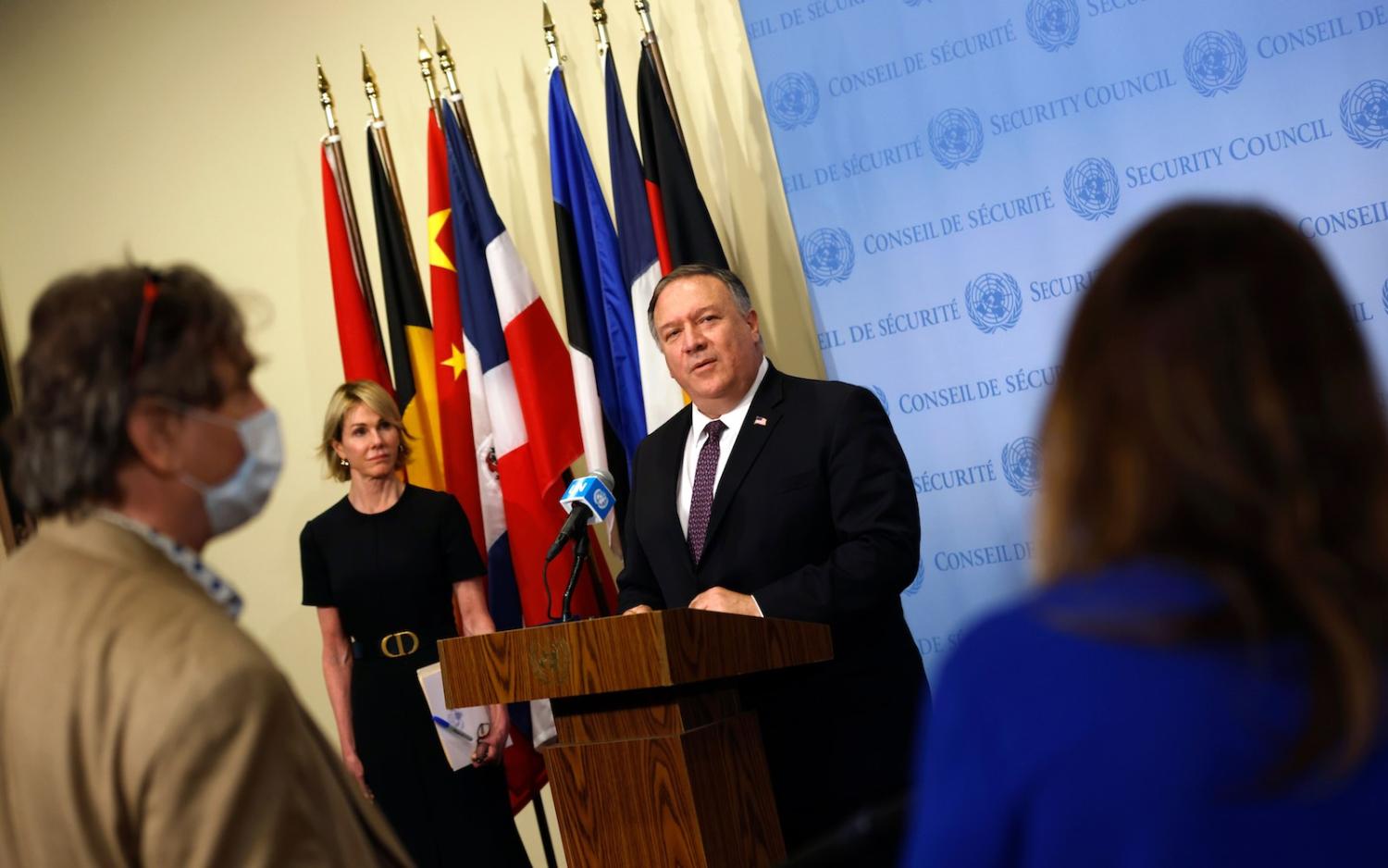 US Secretary of State Mike Pompeo (centre) speaks to reporters following a meeting on Iran at the UN Security Council, 20 August 2020 in New York (Mike Segar/pool/AFP via Getty Images)