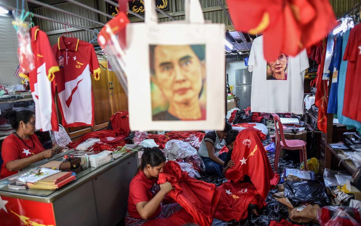 Workers pack T-shirts promoting Aung San Suu Kyi's National League for Democracy party at a print house in Yangon, 2 September 2020 (Ye Aung Thu/AFP via Getty Images)