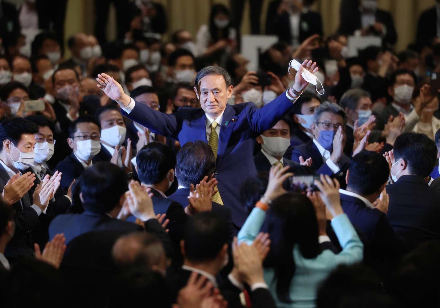 Japan’s Chief Cabinet Secretary Yoshihide Suga reacts after he was elected as new head of Japan’s ruling Liberal Democratic Party on Monday (AFP via Getty Images)