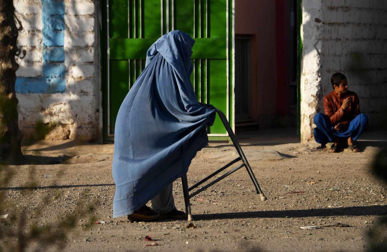 A woman walks in Herat, Afghanistan, 1 March (Hoshang Hashimi/AFP via Getty Images)
