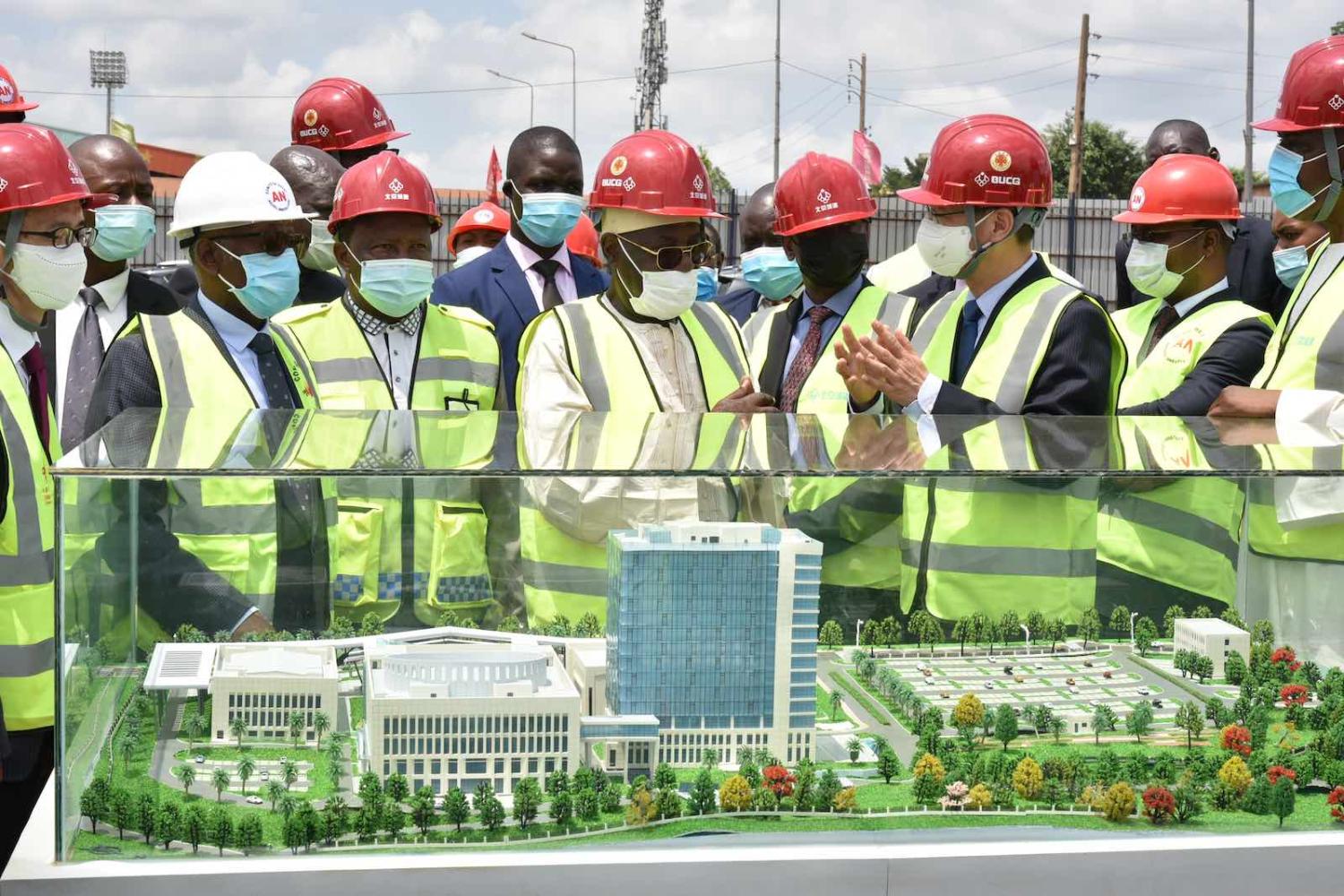 Cameroonian officials and the Chinese Ambassador to Cameroon visit the site of the country’s new National Assembly building, a China-aided project under construction in Yaounde, Cameroon, 23 March 2021 (Jean Pierre Kepseu/Xinhua via Getty Images)