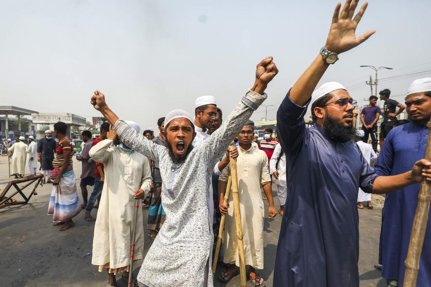Activists from Hefazat-e-Islam block a road following deadly clashes with police over Indian Prime Minister Narendra Modi’s visit, 28 March 2021 in Narayanganj, Bangladesh (Ahmed Salahuddin/NurPhoto via Getty Images)