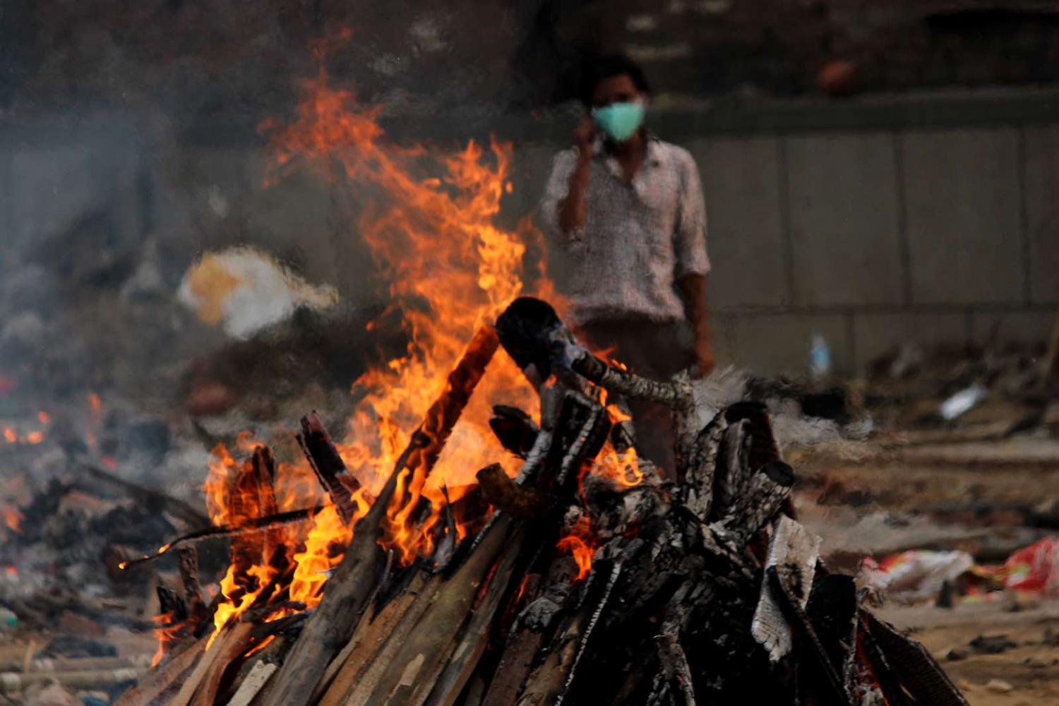 A burning pyre at a makeshift crematorium in Delhi, India on 1 May (Mayank Makhija/NurPhoto via Getty Images)