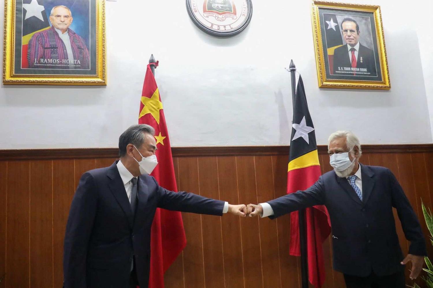 East Timor’s former leader Xanana Gusmao (right) greets China’s Foreign Minister Wang Yi during a meeting in Dili on 4 June (Valentino Dariel Sousa/AFP via Getty Images)