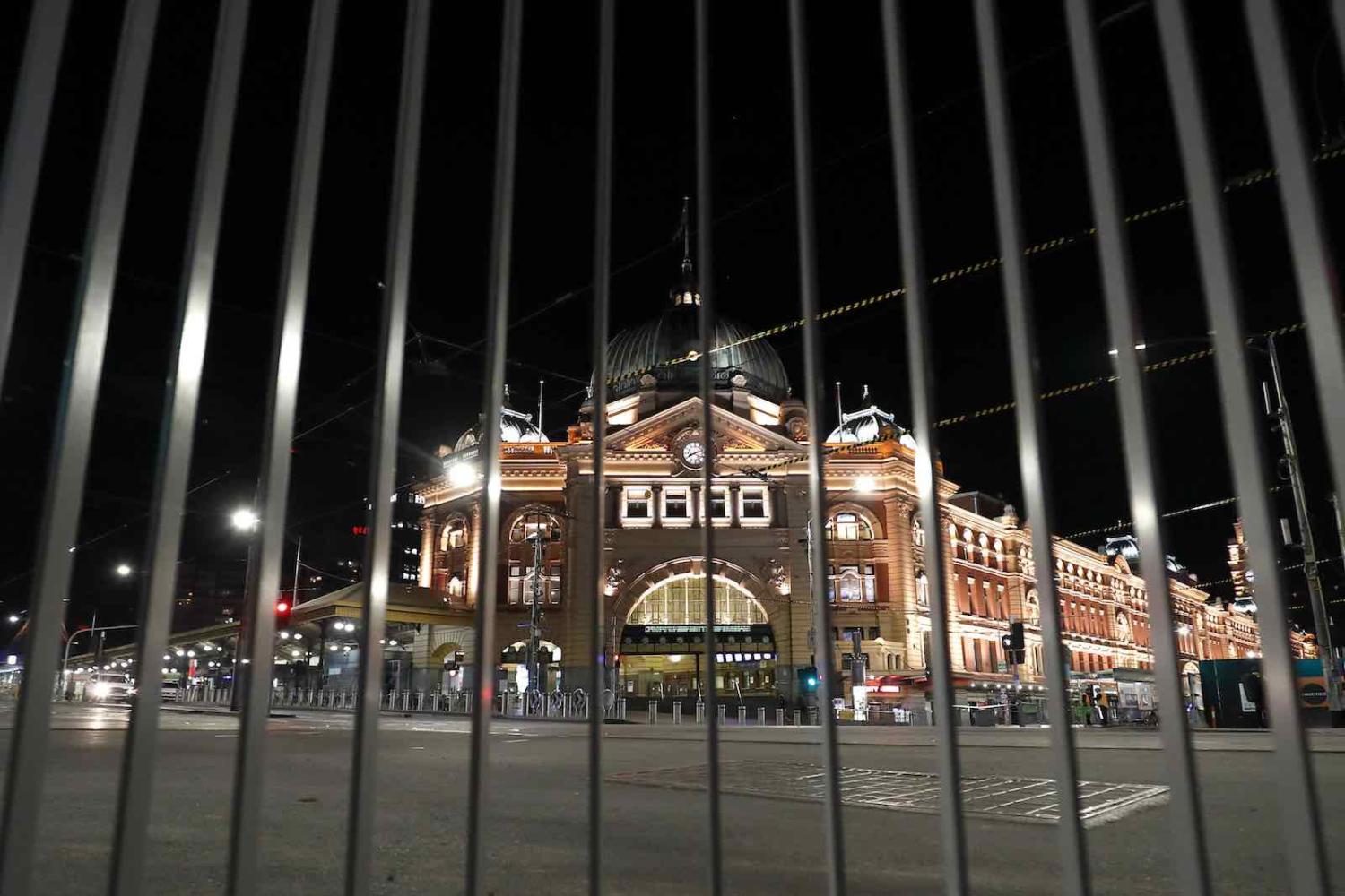 Melbourne’s Flinders St station on the first night of a 8pm to 5am curfew (Darrian Traynor/Getty Images)