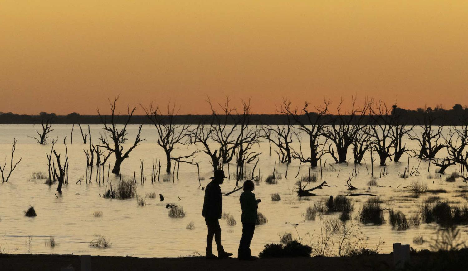 Watching the sunset over Lake Menindee in far-west New South Wales, which filled for the first time earlier this year after five years of drought, 17 May 2021 (Brook Mitchell/Getty Images)