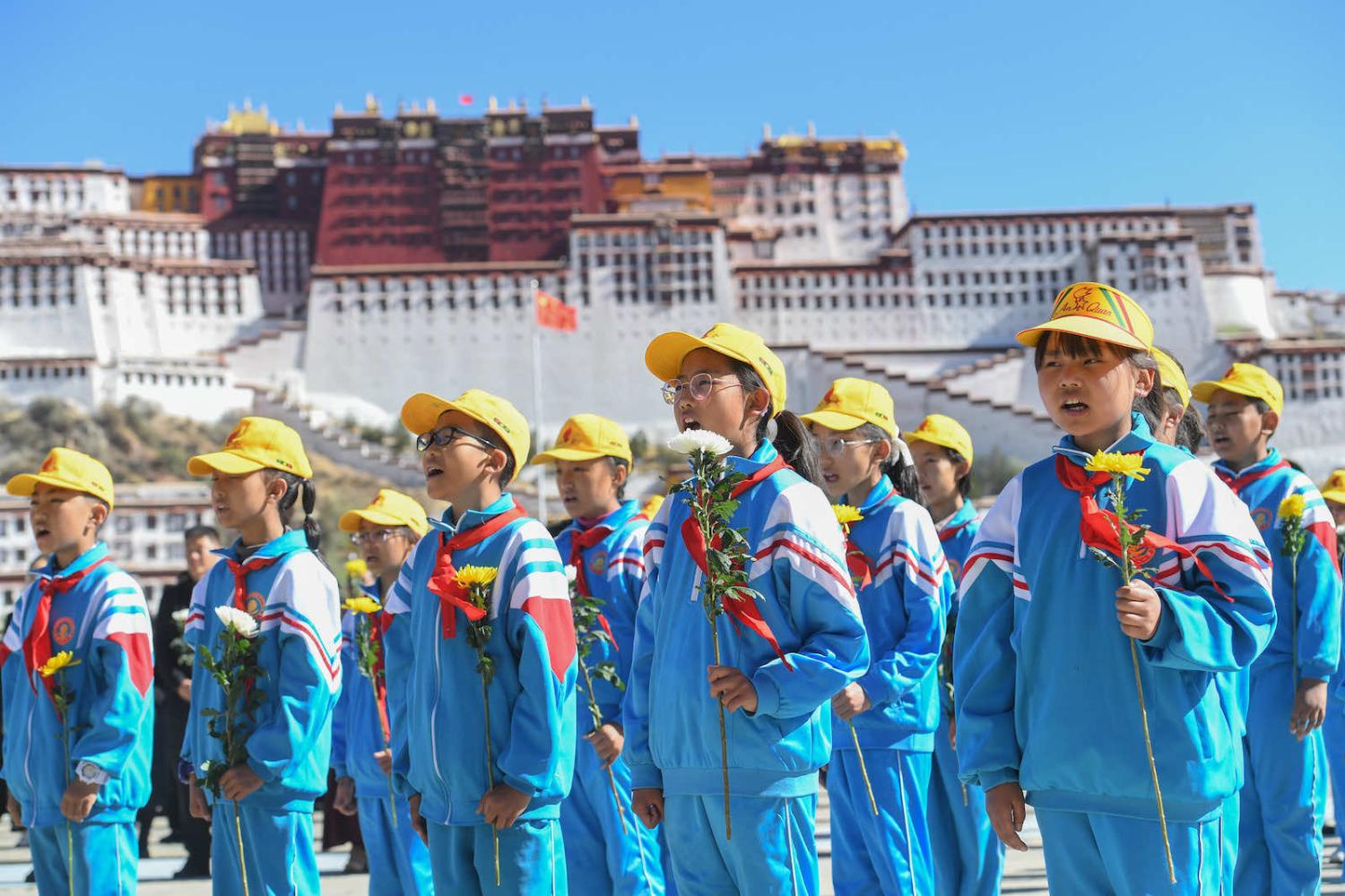 Students sing to mark the 70th anniversary of the “peaceful liberation” of Tibet, 23 May in Lhasa (Photo by Gongga Laisong/China News Service via Getty Images