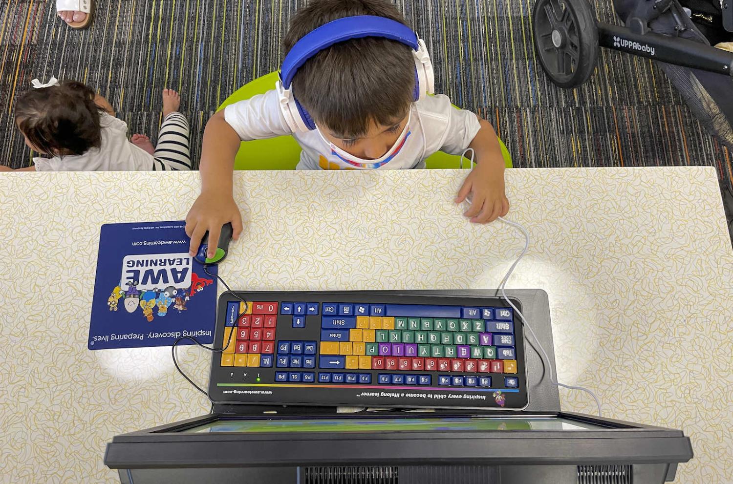 Playing an educational computer game LA County Library, Norwalk, United States (Jeff Gritchen via Getty Images)
