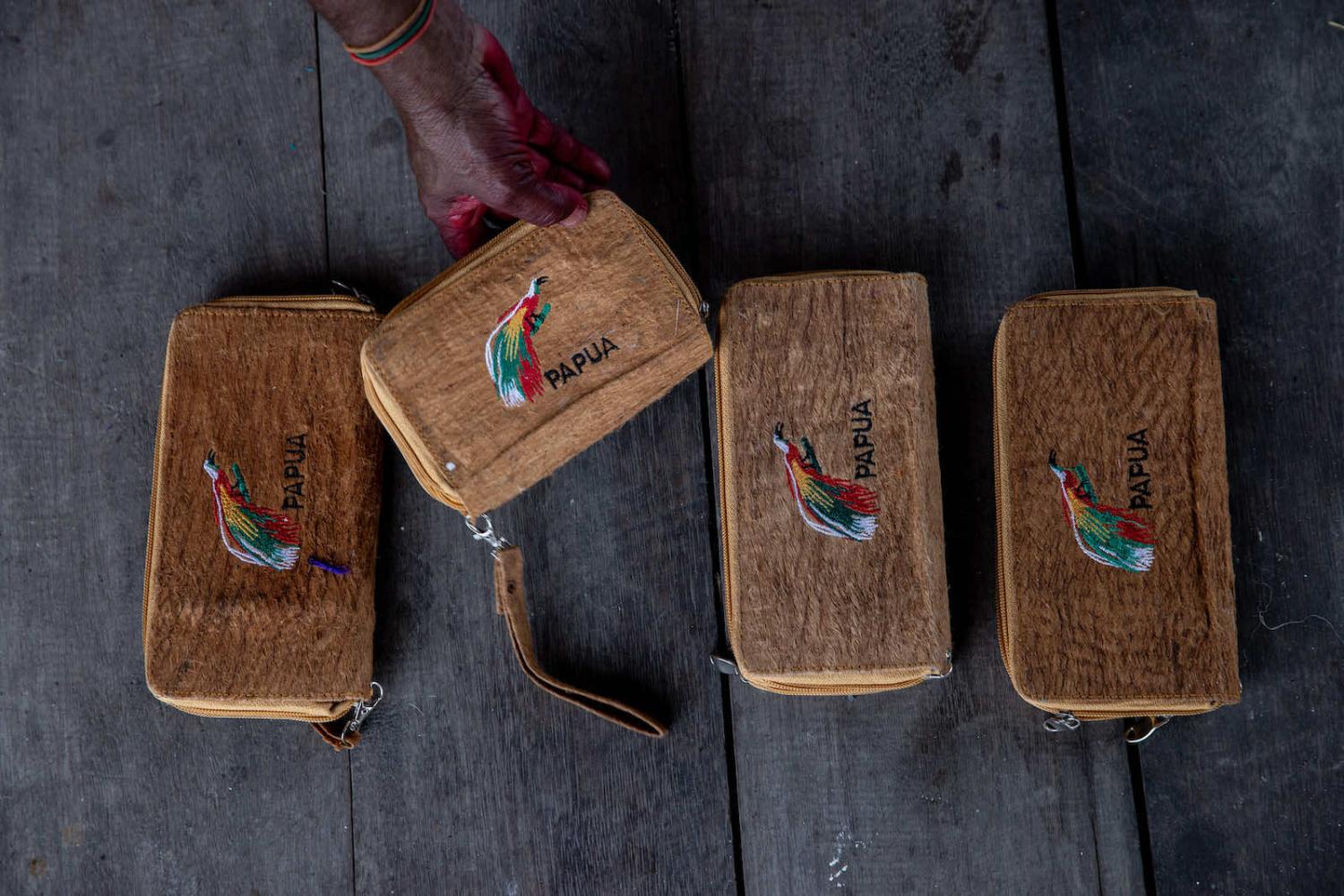 Bark painting wallets at Asei village in Jayapura, a modern adaptation of a traditional craft in the area dating back to at least the 1600s (Robertus Pudyanto/Getty Images)