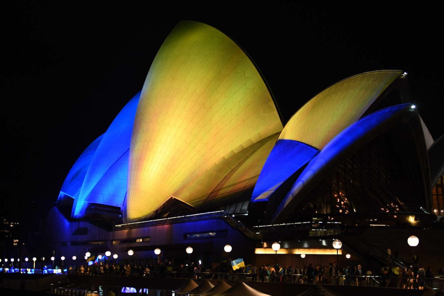 The Sydney Opera House sails are illuminated in yellow and blue to show support for Ukraine after Russian forces invaded the country (James D. Morgan/Getty Images)