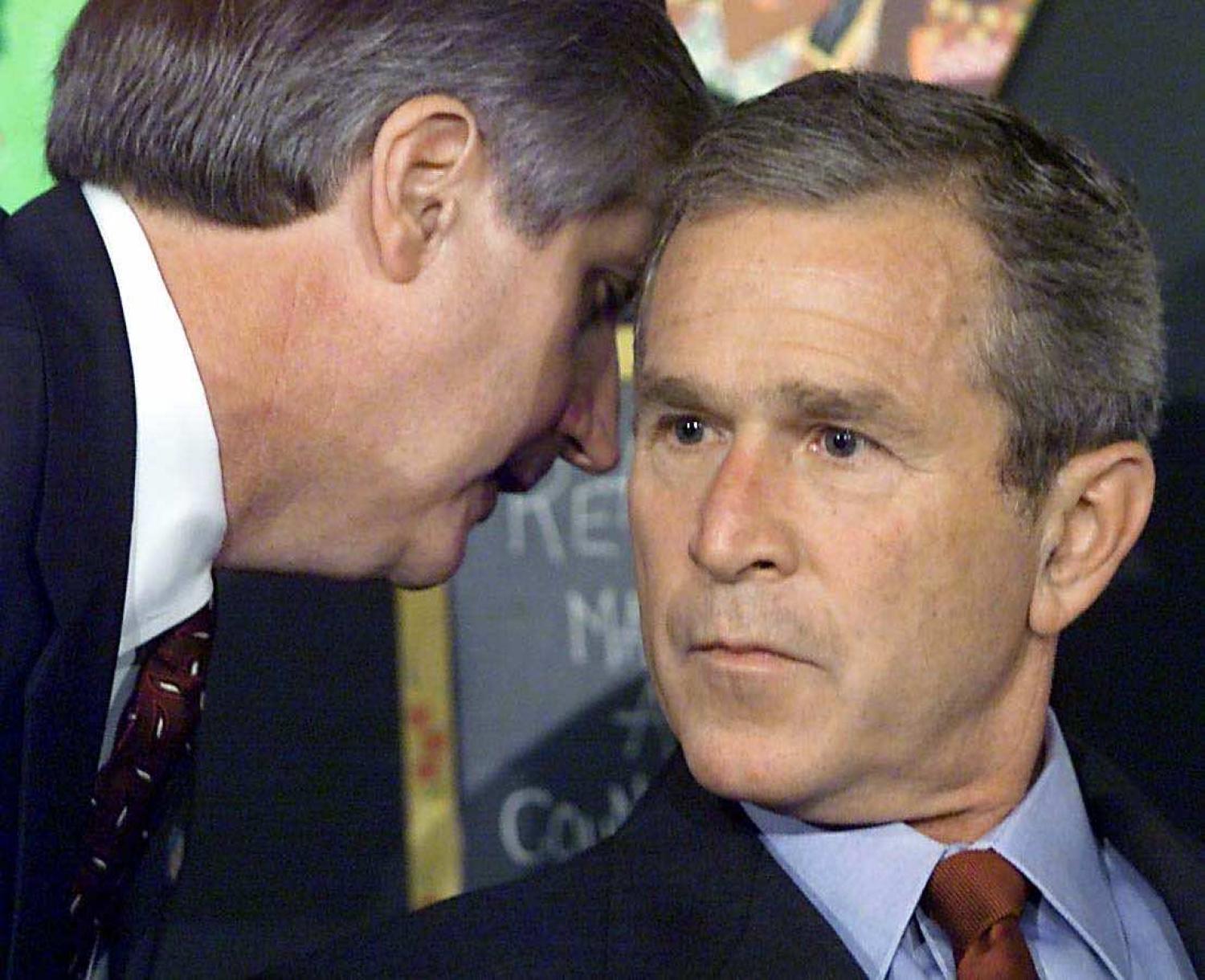 The moment US President George W. Bush has his early morning school reading event interrupted with news of New York, 11 September 2001 (Paul J. Richards/AFP via Getty Images)