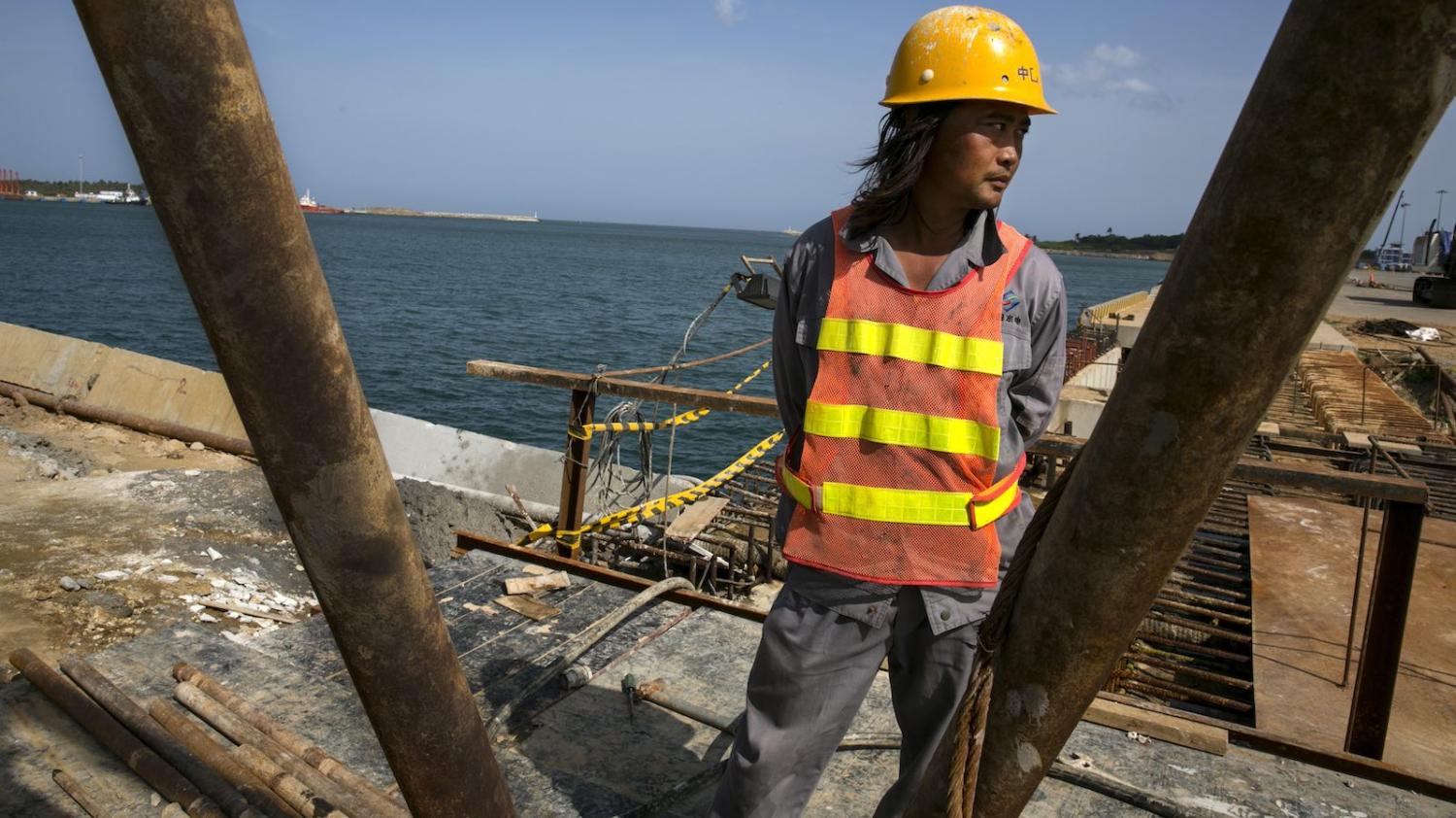 Chinese workers building the Mahida Rajapaksa Port in Hambantota, Sri Lanka, in 2013 (Photo: Paula Bronstein/Getty)