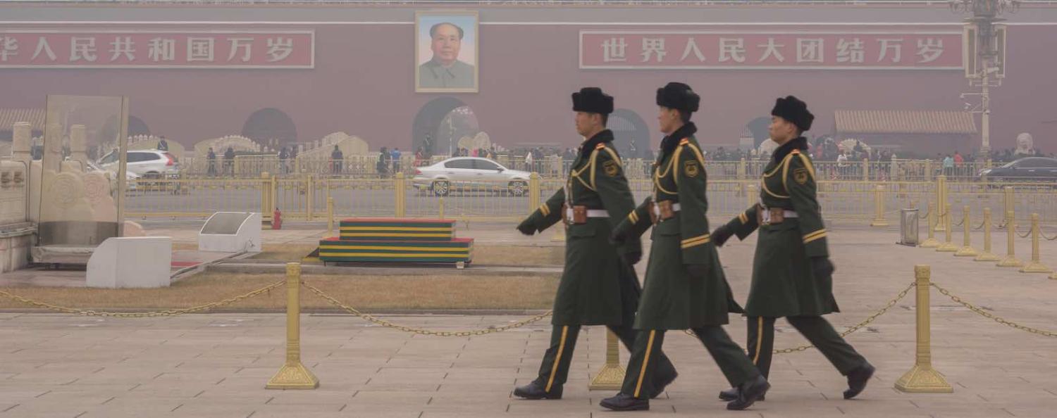 Guard soldiers walk through Tiananmen square in the heavy haze (Photo: VCG via Getty)