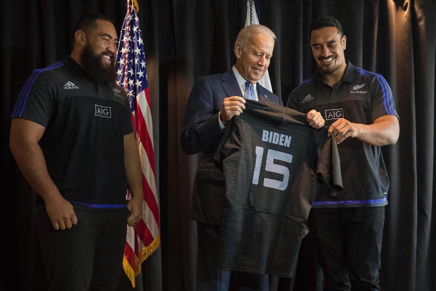 Joe Biden, as US Vice President in July 2016, is presented with an All Blacks jumper during a visit to New Zealand (Chris McKeen/AFP via Getty Images)