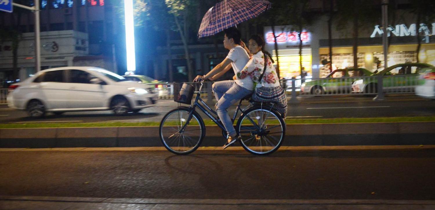 People can peddle faster, but will they get ahead? (Photo: Wang Zhao via Getty)