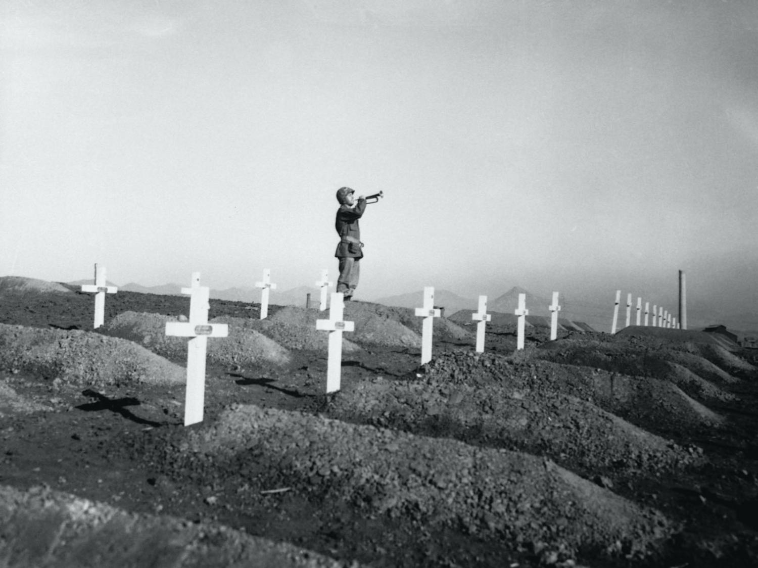 A memorial service on 13 December 1950 in Hungnam, Korea at the graves of fallen US Marines following the break-out from Chosin Reservoir (Corbis via Getty Images)