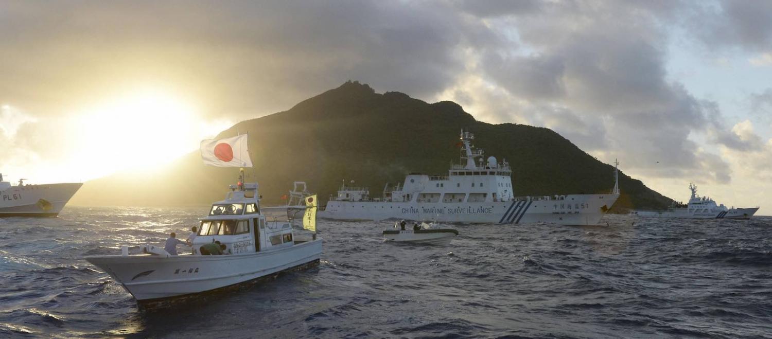Chinese and Japanese vessels passing in 2013 near the disputed Senkaku/Diaoyu Islands in the East China Sea (Photo: Kyodo News Stills via Getty Images)
