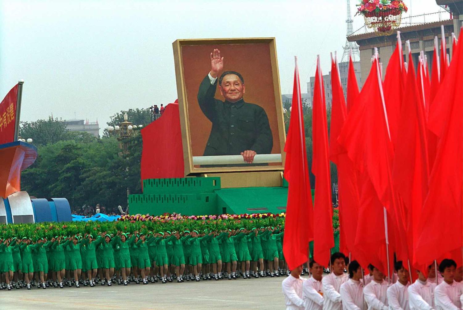 A portrait of Deng Xiaoping is displayed during a parade marking the 50th anniversary of the People' s Republic of China, Tiananmen Square, Beijing, 1 October 1999 (Photo: David Hume Kennerly/Getty Images)