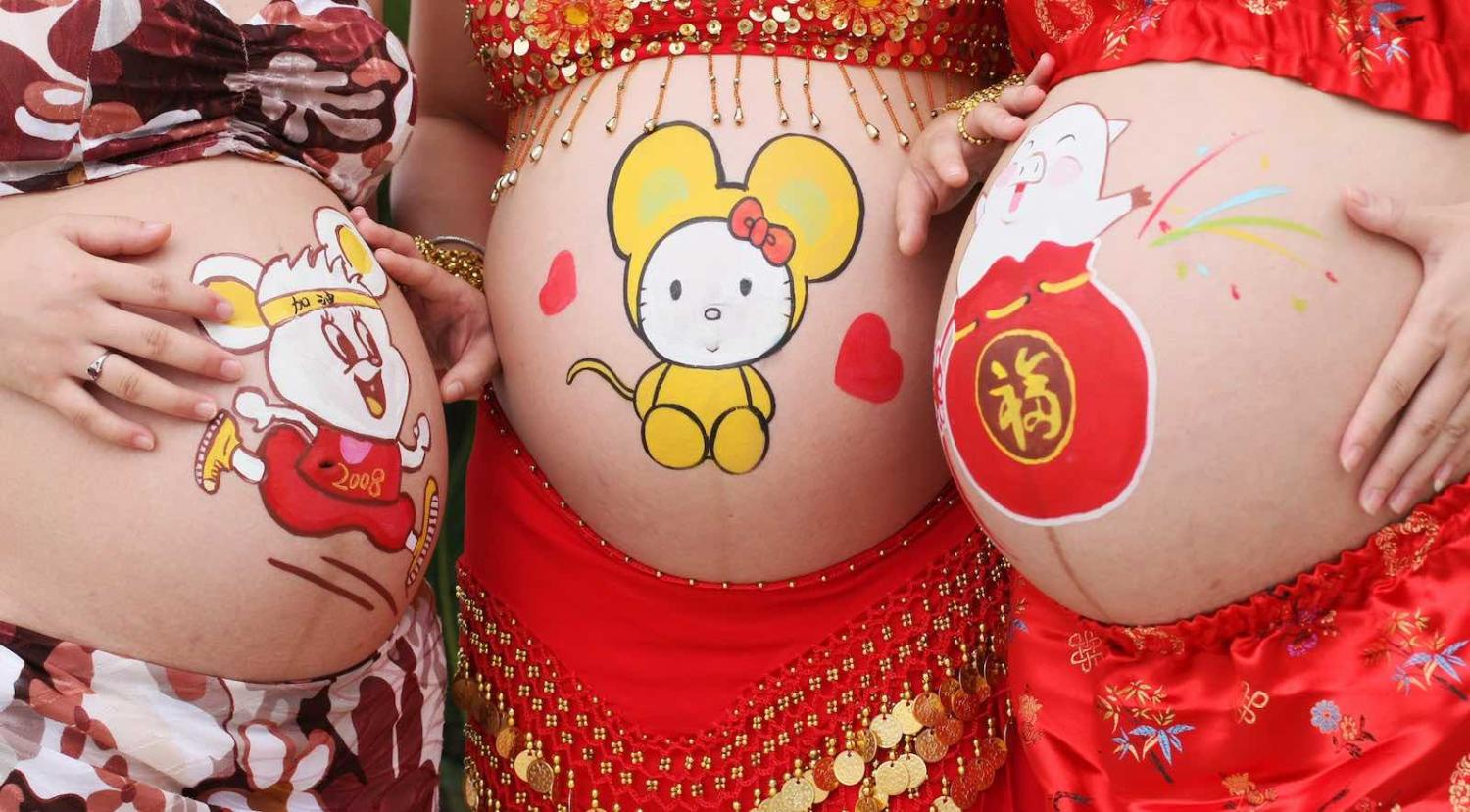 Mothers-to-be at a body-painting competition for pregnant women in Haikou, China (Photo: Zhang Mao via Getty)
