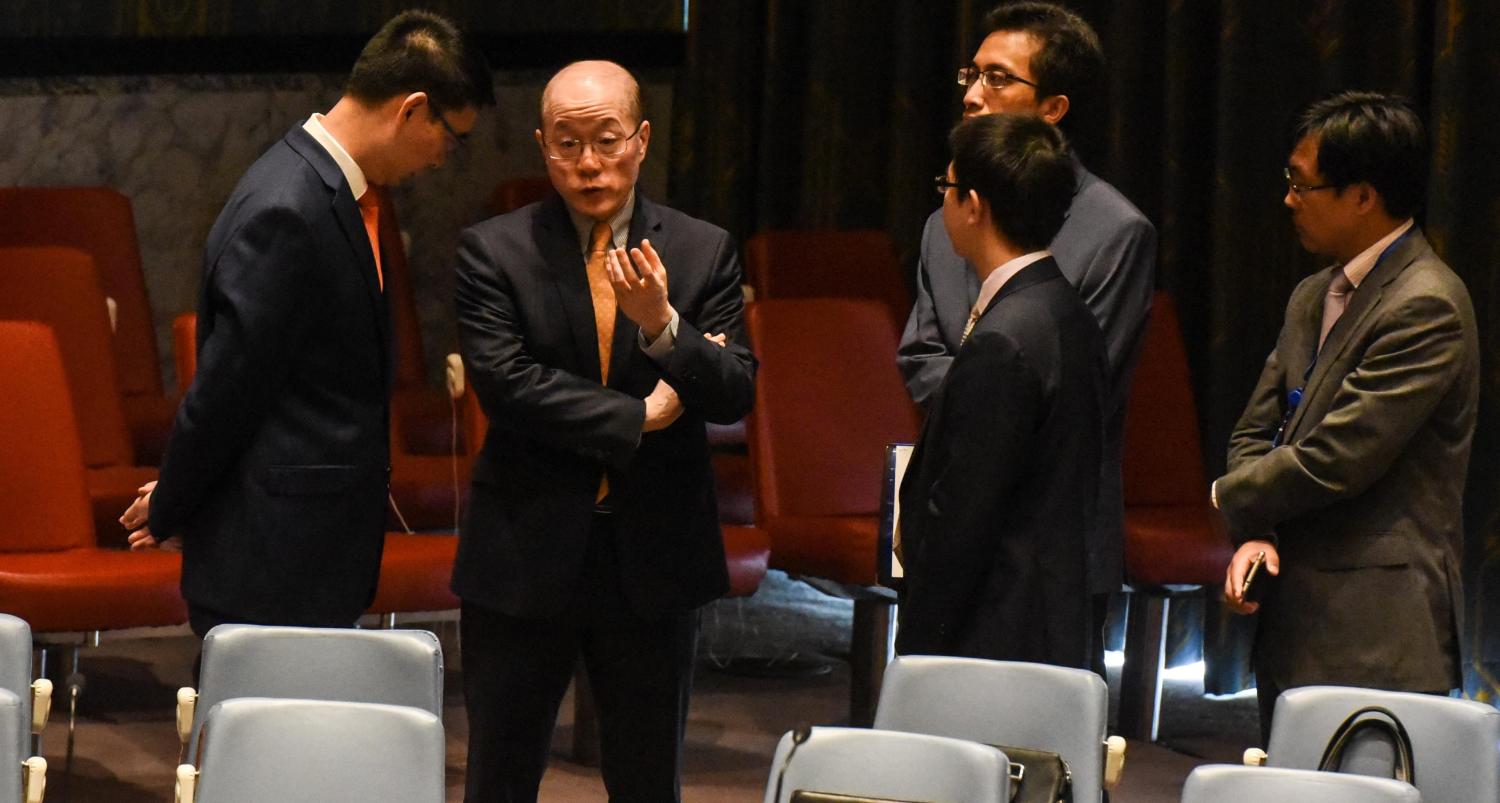 Chinese Ambassador to the UN Liu Jieyi speaks with his team during an emergency UN Security Council meeting to discuss North Korea's nuclear test, September 2017 (Photo: Getty Images/Stephanie Keith)