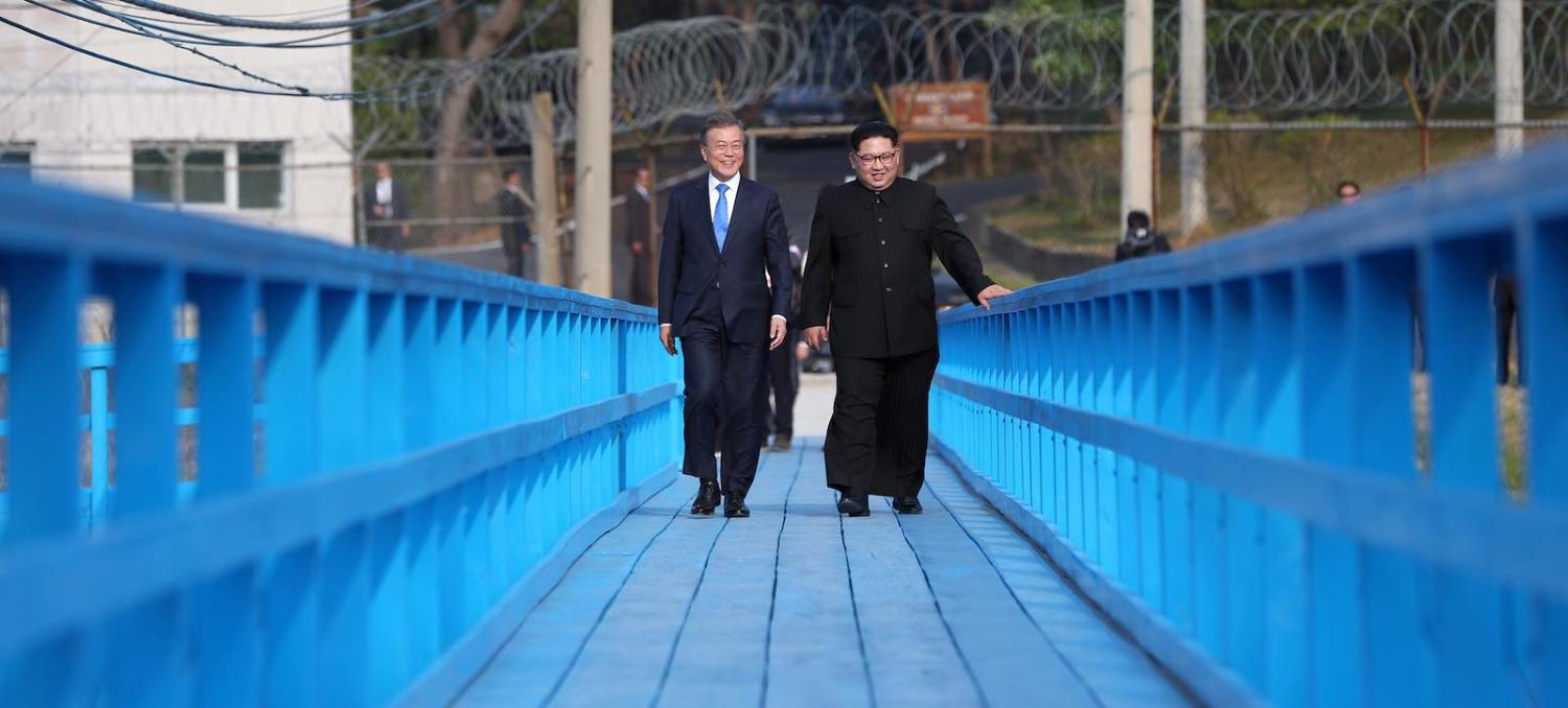 South Korean president Moon Jae-in and North Korean leader Kim Jong-un during their summit in April (Photo via Getty Images)