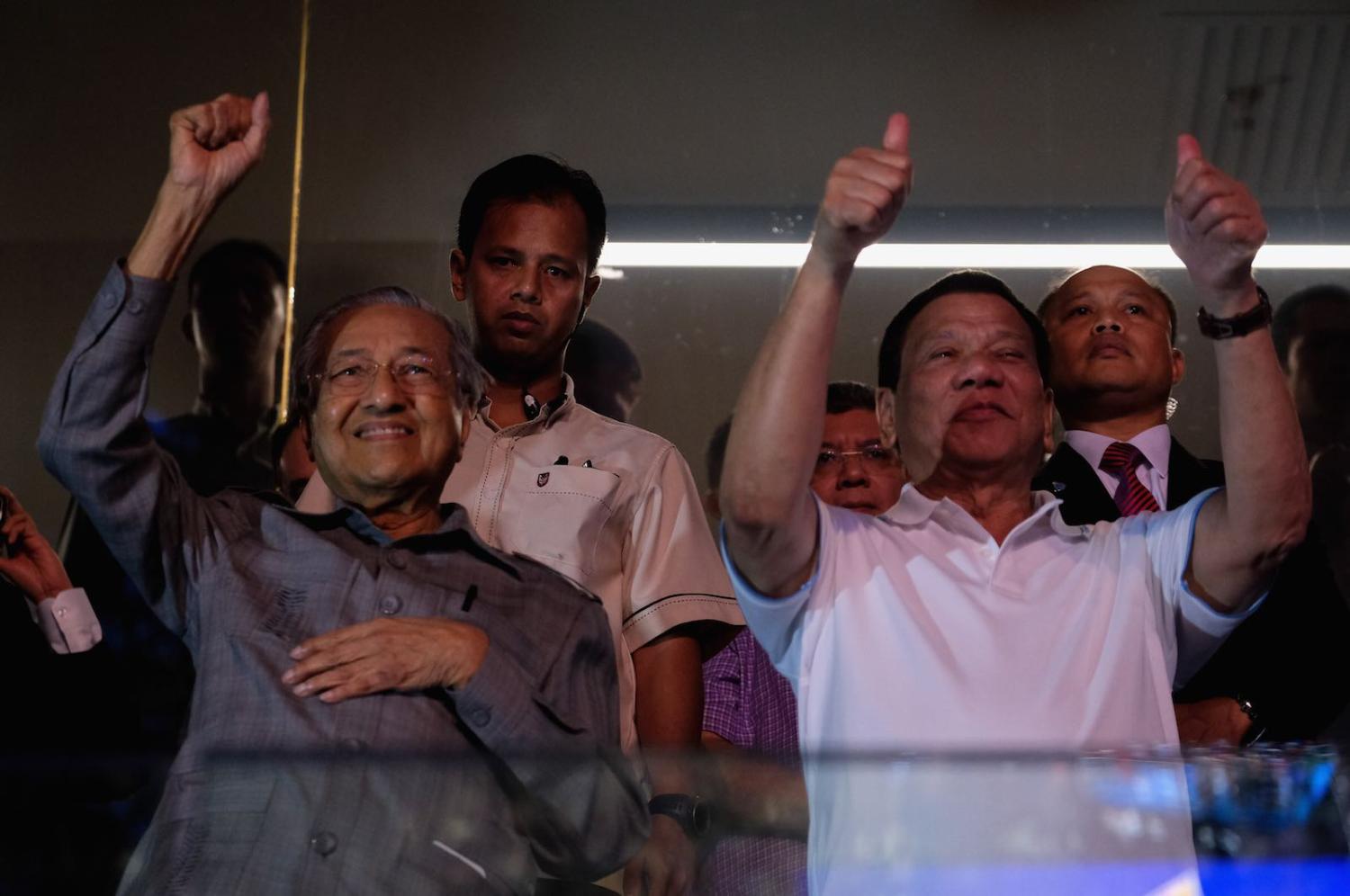 Thumb’s up: Malaysia's Mahathir Mohamed and the Philippines’ Rodrigo Duterte cheer in a boxing match in 2018 (Photo: Mohd Samsul Mohd Said/Getty)