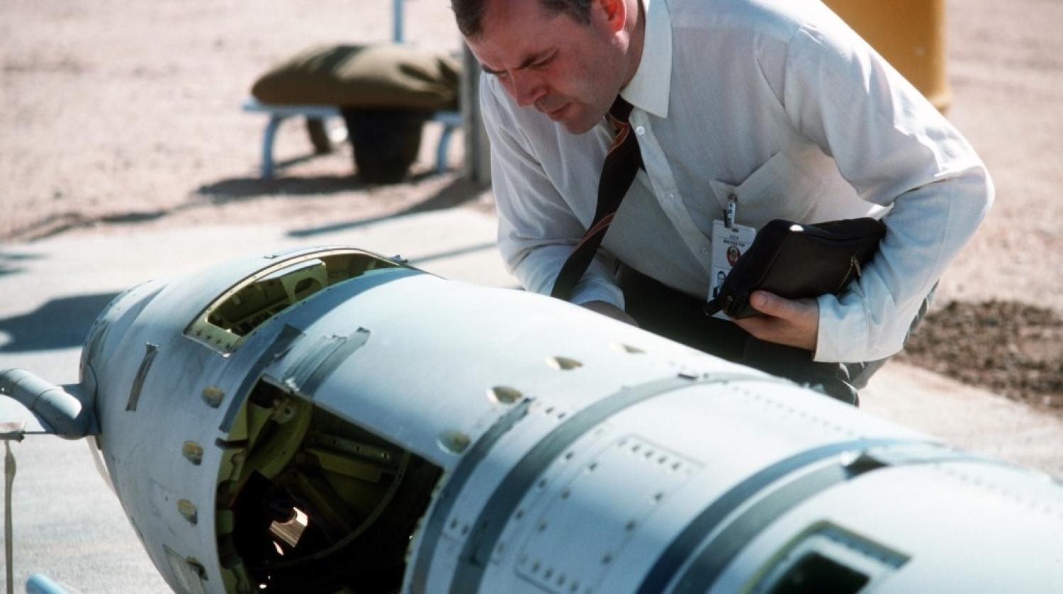 A Soviet inspector examines a ground-launched cruise missile banned under the 1988 INF treaty. (Wikipedia)