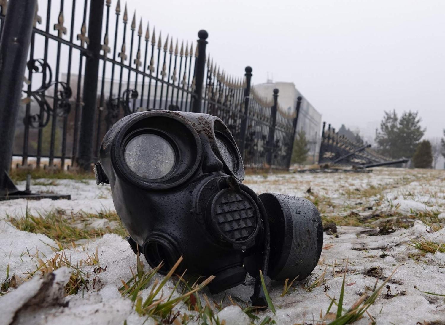 A gas mask in central Almaty is one of the few signs of protests that erupted over hikes in fuel prices, 7 January 2022 (Abduaziz Madyarov/AFP via Getty Images)