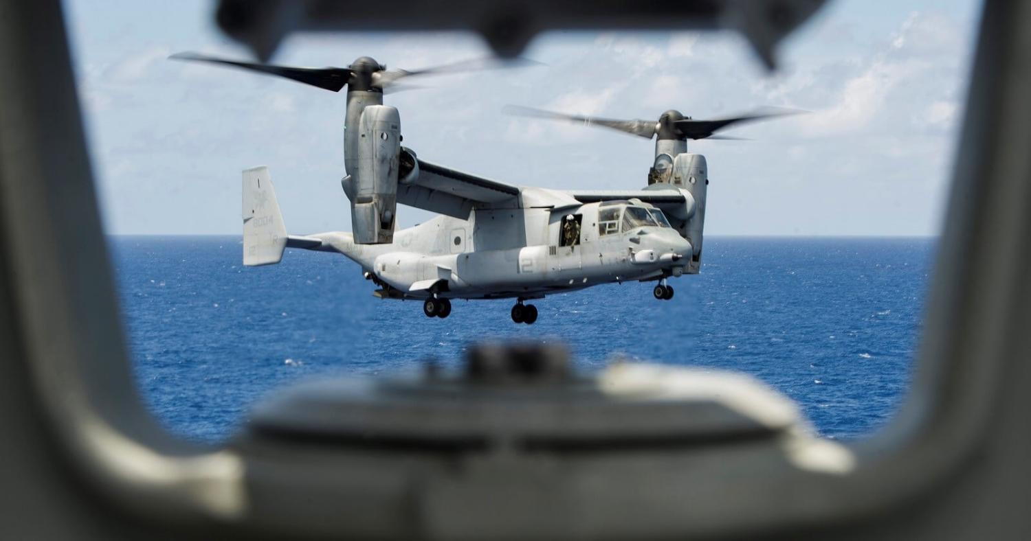 An MV-22 Osprey prepares to land on the USS America in the Pacific Ocean (Photo: US Pacific Fleet/Flickr)