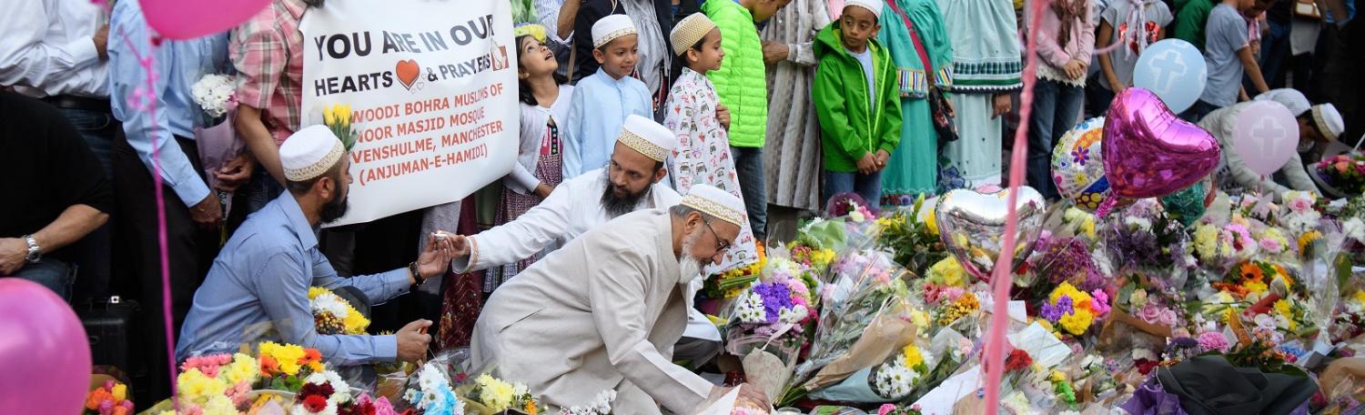 Members of Manchester's Muslim community were among those at public tributes to the victims and their families (Photo: Leon Neal/Getty)