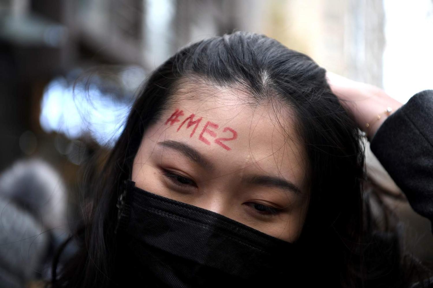 A supporter of feminist figure Zhou Xiaoxuan outside Haidian District People’s Court in Beijing, 2 December 2020 (Noel Celis/AFP via Getty Images)