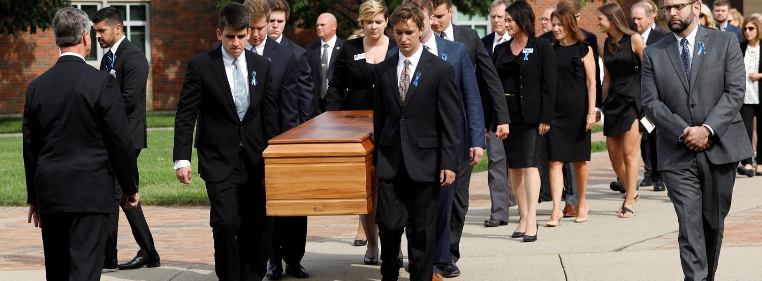 The casket of Otto Warmbier is carried out from his funeral on 22 June in Wyoming, Ohio. (Photo:Bill Pugliano/Getty Images)