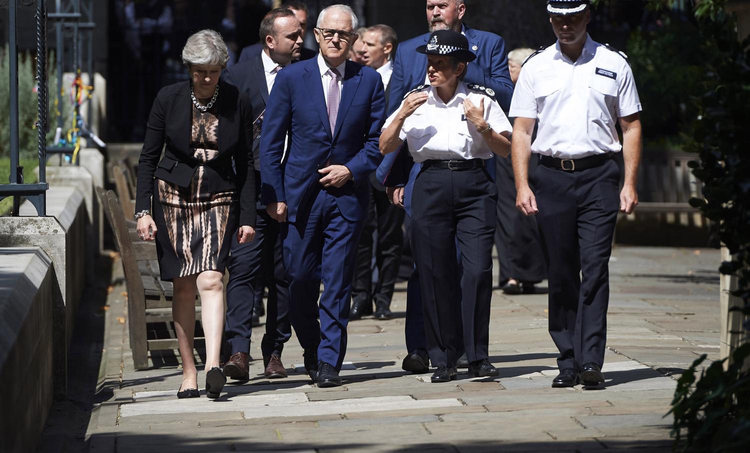 The UK PM Theresa May and Australian PM Malcolm Turnbull speaking with first responders from London's 3 June terrorist attack  last week (Photo: Niklas Hallen/Getty Images)